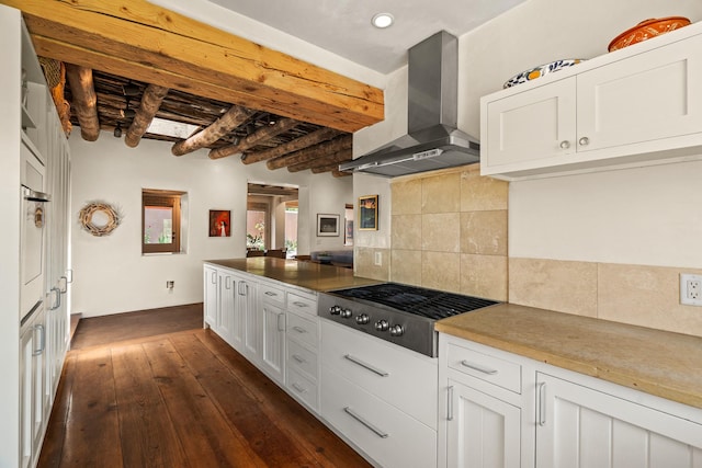 127 County Road 84, Santa Fe, NM 87506 - kitchen with wall chimney exhaust hood, stainless steel gas stovetop, white cabinets, dark wood-style floors, and decorative backsplash