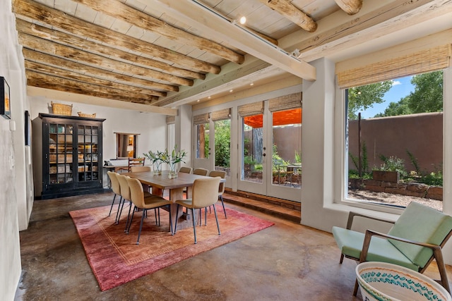 127 County Road 84, Santa Fe, NM 87506 - dining space featuring concrete flooring, french doors, beam ceiling, and wooden ceiling