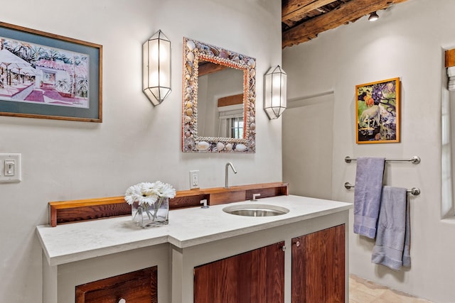 127 County Road 84, Santa Fe, NM 87506 - bathroom featuring beamed ceiling and vanity