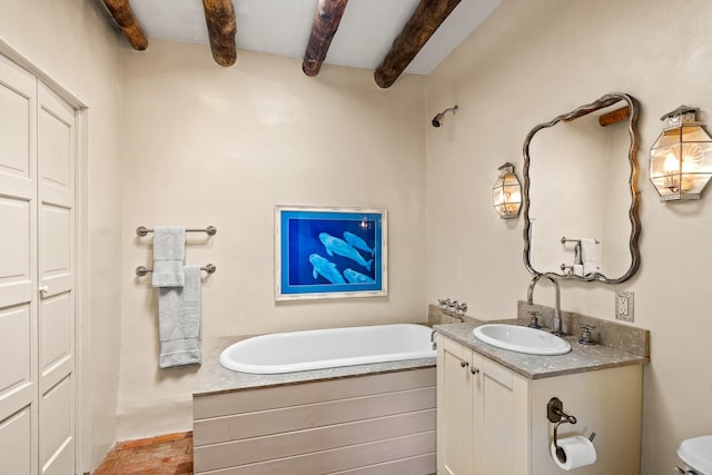 127 County Road 84, Santa Fe, NM 87506 - bathroom with beamed ceiling, a garden tub, vanity, and toilet