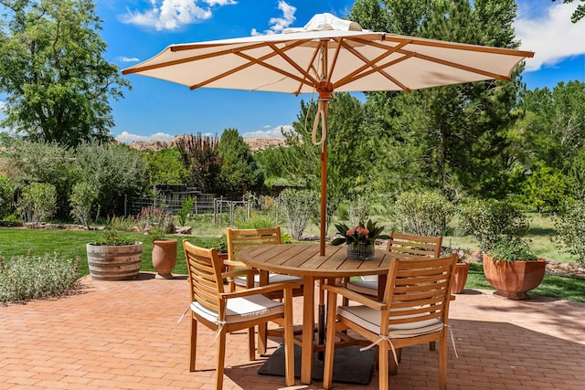 127 County Road 84, Santa Fe, NM 87506 - view of patio / terrace featuring outdoor dining area and fence