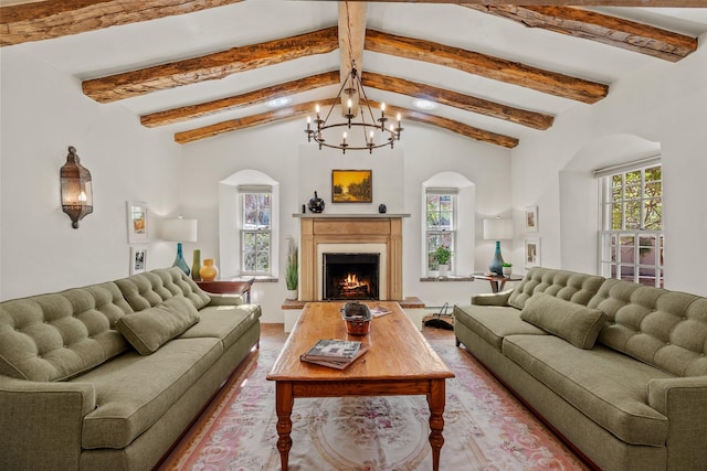 767 Acequia Madre Unit 1, Santa Fe, NM 87505 - living room featuring a chandelier, a warm lit fireplace, and arched walkways