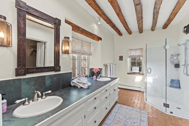 767 Acequia Madre Unit 1, Santa Fe, NM 87505 - full bathroom featuring baseboard heating, brick floors, a stall shower, beam ceiling, and double vanity