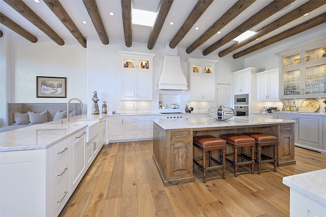 3289 Monte Sereno, Santa Fe, NM 87506 - kitchen featuring a sink, stainless steel oven, recessed lighting, beam ceiling, and tasteful backsplash