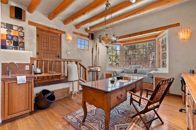 17 Tano W, Santa Fe, NM 87506 - office with light wood-type flooring, a sink, beam ceiling, and baseboards