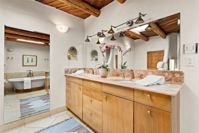 17 Tano W, Santa Fe, NM 87506 - full bath featuring wood ceiling with exposed beams, tile patterned floors, double vanity, and a freestanding tub