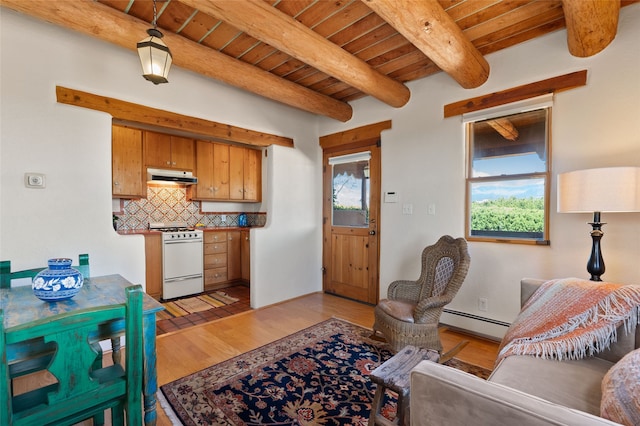 17 Tano W, Santa Fe, NM 87506 - kitchen with white range with gas stovetop, under cabinet range hood, a baseboard radiator, wood ceiling with exposed beams, and decorative backsplash
