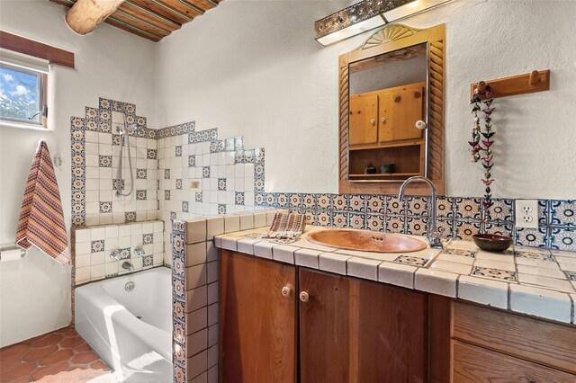17 Tano W, Santa Fe, NM 87506 - bathroom with backsplash, a garden tub, tile patterned floors, and vanity