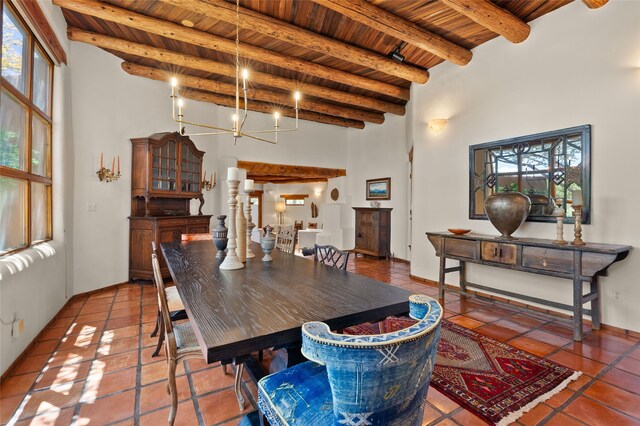 17 Tano W, Santa Fe, NM 87506 - tiled dining area with wooden ceiling with exposed beams, a high ceiling, and a chandelier