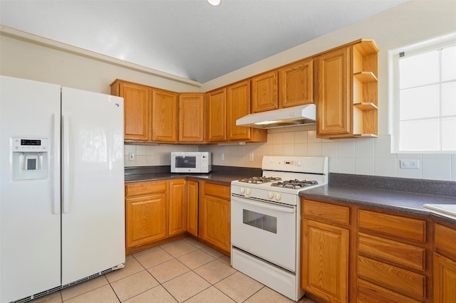 1905 Mendius, Los Alamos, NM 87544 - kitchen featuring white appliances, under cabinet range hood, dark countertops, and decorative backsplash