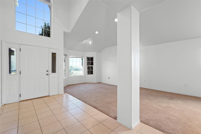 1905 Mendius, Los Alamos, NM 87544 - foyer entrance with light colored carpet, light tile patterned flooring, high vaulted ceiling, and recessed lighting