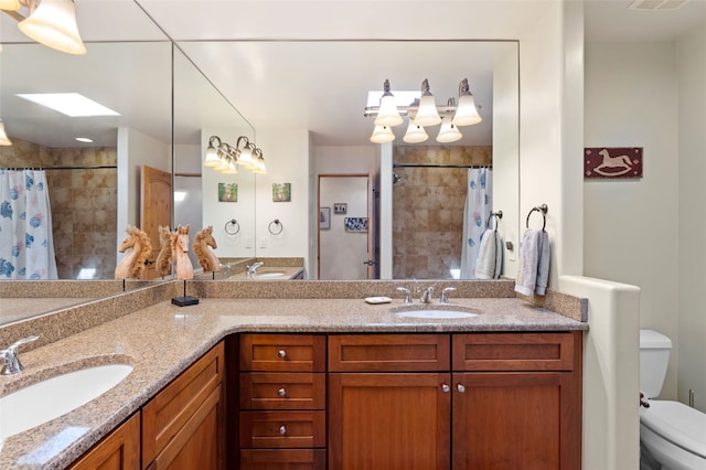 2 Tierra Grande, Santa Fe, NM 87506 - full bathroom featuring double vanity, toilet, and a tile shower