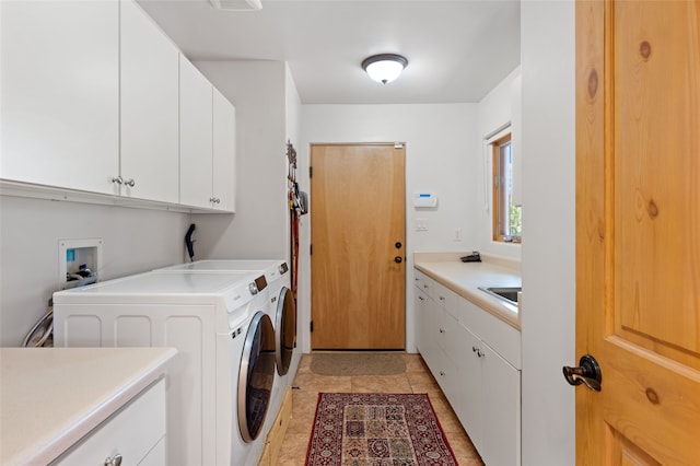 2 Tierra Grande, Santa Fe, NM 87506 - laundry room featuring cabinet space, washing machine and dryer, and light tile patterned floors
