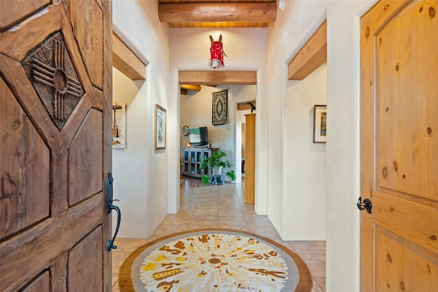 2 Tierra Grande, Santa Fe, NM 87506 - foyer entrance with beamed ceiling, inlaid floor details, and light tile patterned flooring