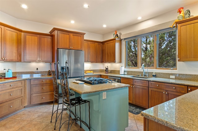 2 Tierra Grande, Santa Fe, NM 87506 - kitchen featuring a sink, recessed lighting, a kitchen island, light stone countertops, and stainless steel fridge with ice dispenser