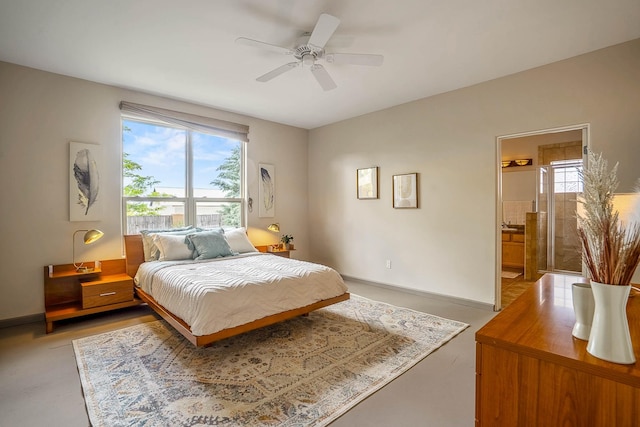 4548 Contenta Rdg, Santa Fe, NM 87507 - bedroom with multiple windows, baseboards, connected bathroom, and ceiling fan