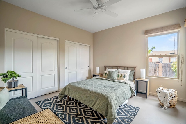 4548 Contenta Rdg, Santa Fe, NM 87507 - bedroom with two closets, baseboards, and a ceiling fan