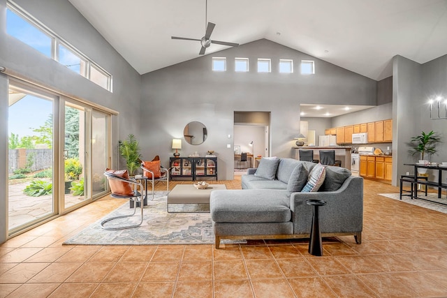 4548 Contenta Rdg, Santa Fe, NM 87507 - living area featuring light tile patterned floors, ceiling fan, and high vaulted ceiling