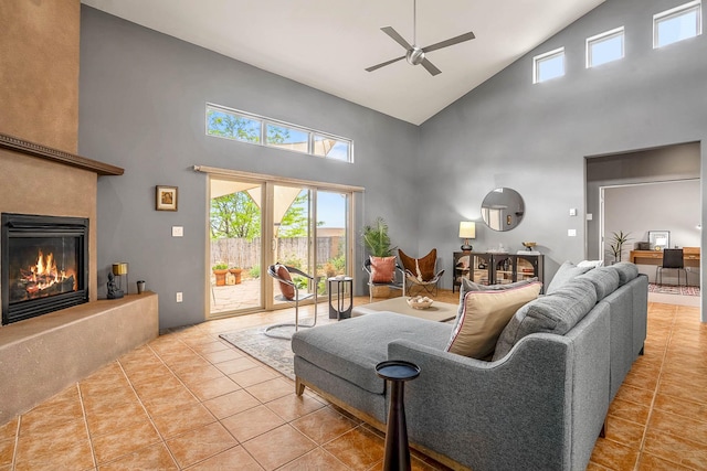 4548 Contenta Rdg, Santa Fe, NM 87507 - living area featuring high vaulted ceiling, a glass covered fireplace, tile patterned flooring, a ceiling fan, and plenty of natural light