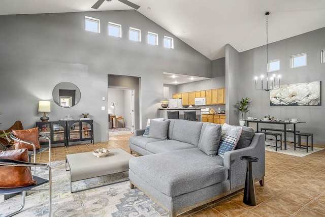 4548 Contenta Rdg, Santa Fe, NM 87507 - living room featuring high vaulted ceiling, a ceiling fan, a chandelier, light tile patterned floors, and baseboards