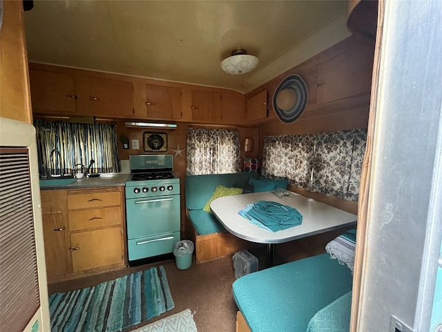 6 Rainbow Trout Ln, Pecos, NM 87552 - kitchen with range with gas stovetop, a heating unit, and breakfast area