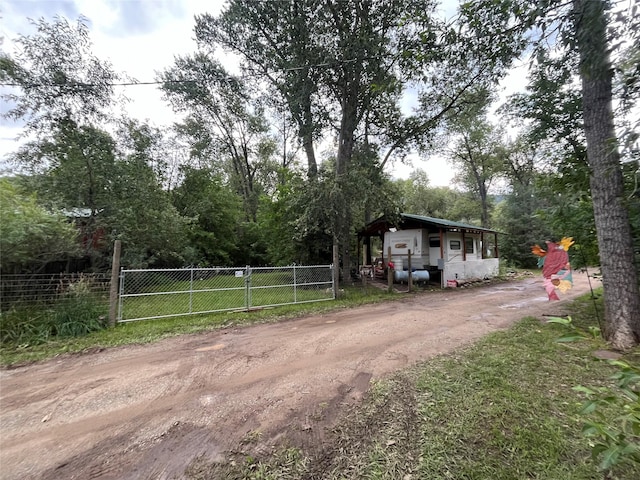 6 Rainbow Trout Ln, Pecos, NM 87552 - view of front of home with dirt driveway
