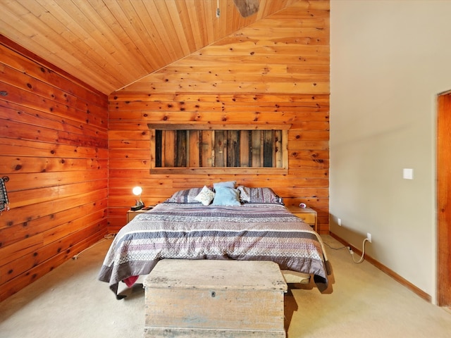 125 Apache Canyon Trl, Santa Fe, NM 87505 - carpeted bedroom with lofted ceiling, wood walls, baseboards, and wooden ceiling