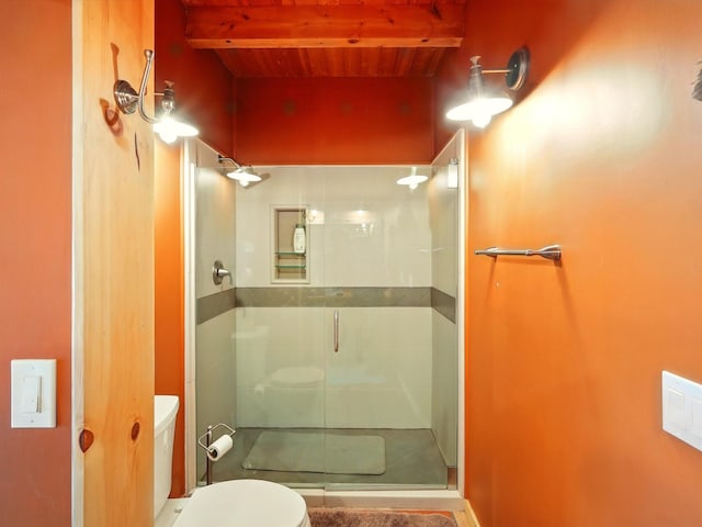 125 Apache Canyon Trl, Santa Fe, NM 87505 - full bath featuring wooden ceiling with exposed beams, a shower stall, and toilet