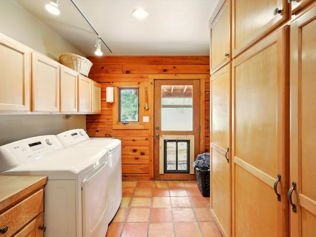 125 Apache Canyon Trl, Santa Fe, NM 87505 - laundry area featuring cabinet space, independent washer and dryer, and wood walls