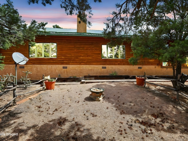 125 Apache Canyon Trl, Santa Fe, NM 87505 - view of front of house featuring crawl space, metal roof, a chimney, and log exterior