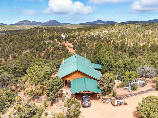 125 Apache Canyon Trl, Santa Fe, NM 87505 - view of subject property featuring a mountain backdrop and a heavily wooded area