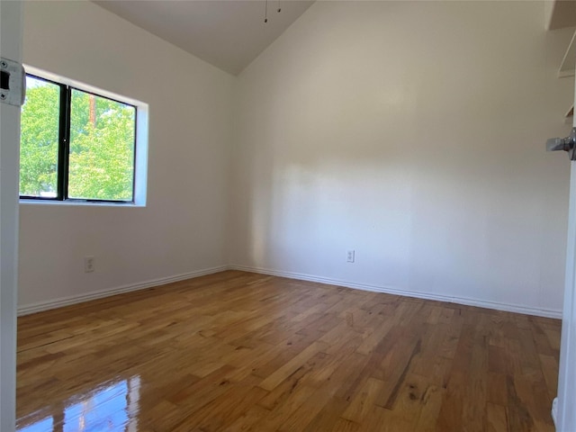 421 Maple Ave, Chama, NM 87520 - unfurnished room featuring vaulted ceiling, wood finished floors, and baseboards