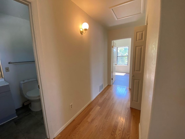 421 Maple Ave, Chama, NM 87520 - hallway with attic access, light wood finished floors, and baseboards