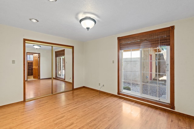 1024 Camino Vista Aurora, Santa Fe, NM 87507 - unfurnished room featuring light wood-style floors and baseboards