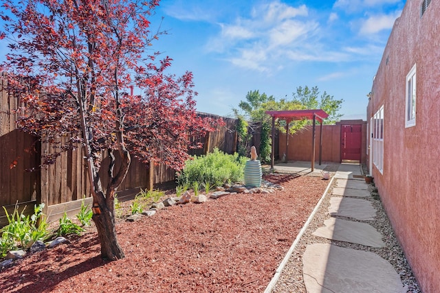 1024 Camino Vista Aurora, Santa Fe, NM 87507 - fenced backyard with a patio area