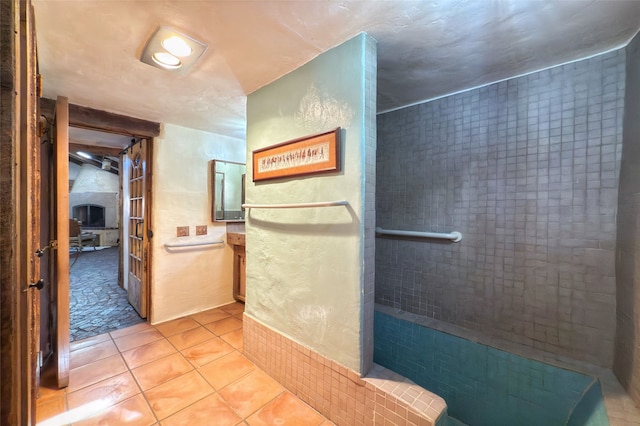 1330 Cerro Gordo Unit F, Santa Fe, NM 87501 - full bathroom featuring tile patterned flooring, vanity, and a tile shower
