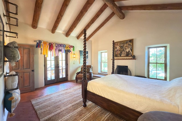 1330 Cerro Gordo Unit F, Santa Fe, NM 87501 - bedroom featuring french doors, multiple windows, beam ceiling, access to exterior, and high vaulted ceiling
