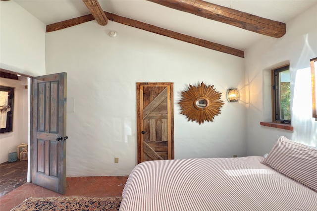 1330 Cerro Gordo Unit F, Santa Fe, NM 87501 - bedroom featuring beamed ceiling and high vaulted ceiling
