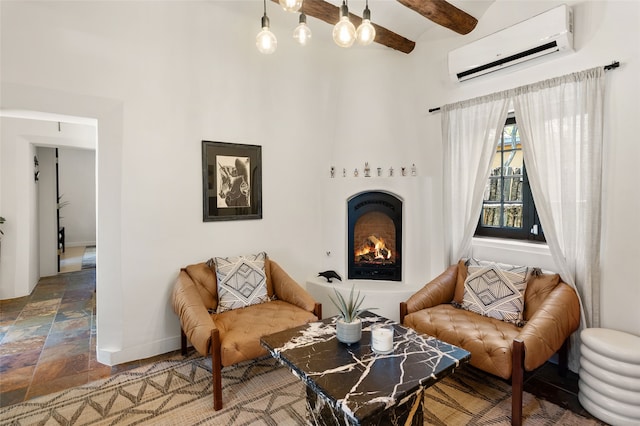 824 Dunlap St Unit A, Santa Fe, NM 87501 - living area with a wall mounted air conditioner, stone finish flooring, a lit fireplace, baseboards, and beam ceiling