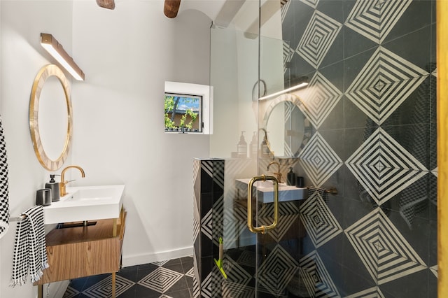 824 Dunlap St Unit A, Santa Fe, NM 87501 - bathroom featuring tile patterned floors, vanity, tiled shower, and baseboards