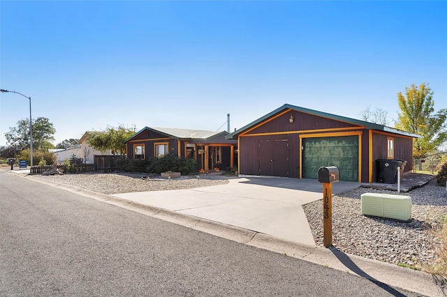1043 Cheyenne, Los Alamos, NM 87544 - view of front of house featuring an attached garage and concrete driveway