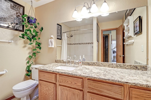 444 Aragon, White Rock, NM 87547 - bathroom featuring toilet, vanity, and a shower with shower curtain