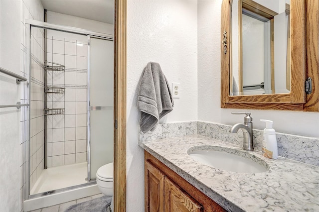 444 Aragon, White Rock, NM 87547 - full bathroom with toilet, vanity, and a shower stall