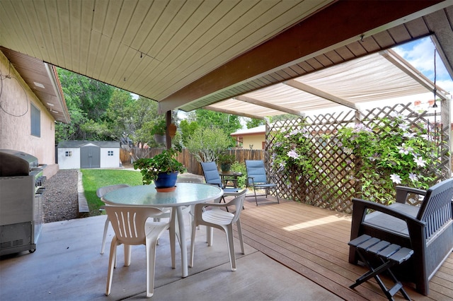 444 Aragon, White Rock, NM 87547 - wooden deck with outdoor dining space, a fenced backyard, a grill, and a patio area