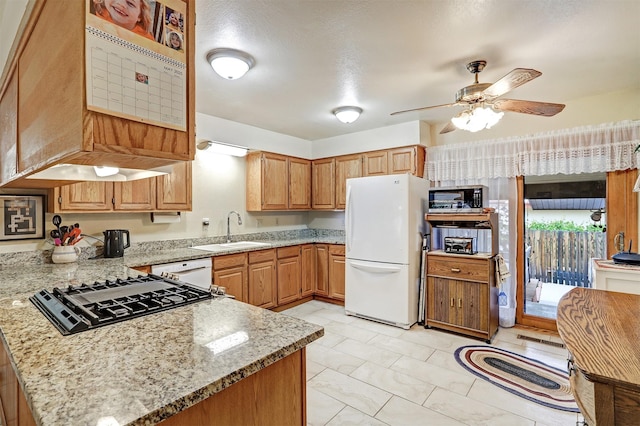 444 Aragon, White Rock, NM 87547 - kitchen featuring white appliances, a sink, a peninsula, light stone counters, and ceiling fan