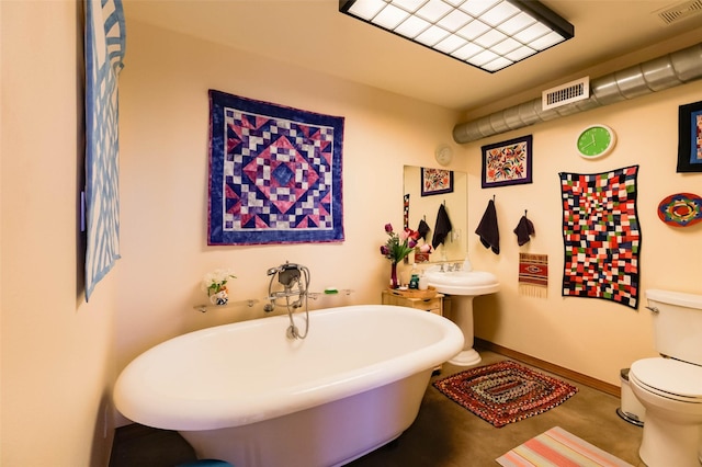 3600 Cerrillos Unit 208, Santa Fe, NM 87507 - bathroom featuring a soaking tub, toilet, and baseboards