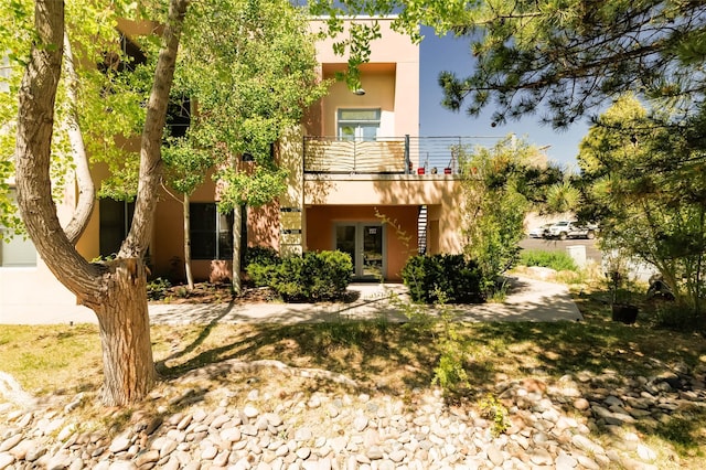 3600 Cerrillos Unit 208, Santa Fe, NM 87507 - back of house with french doors, a balcony, and stucco siding