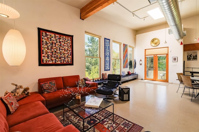 3600 Cerrillos Unit 208, Santa Fe, NM 87507 - living room with beamed ceiling, tile patterned floors, and a skylight
