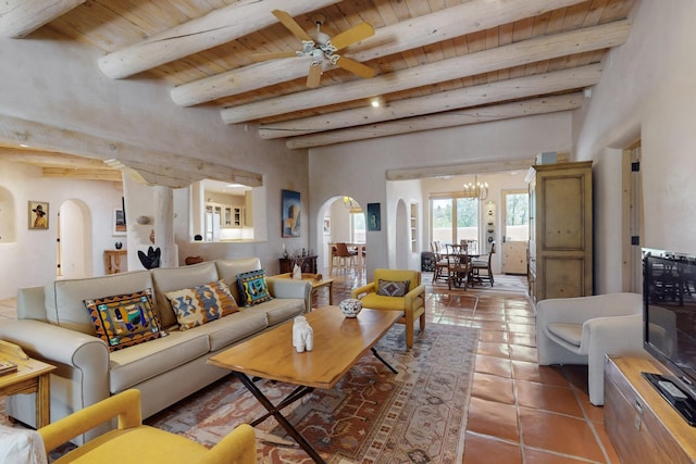 425 Calle Kokopelli, Santa Fe, NM 87501 - living area with arched walkways, wooden ceiling with exposed beams, tile patterned flooring, a ceiling fan, and a chandelier