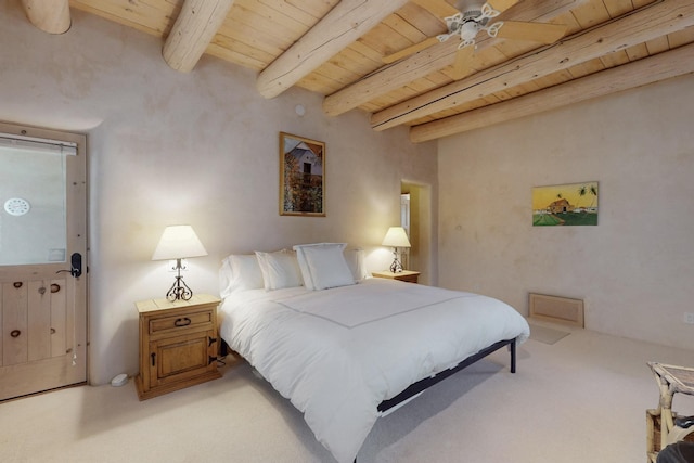 425 Calle Kokopelli, Santa Fe, NM 87501 - bedroom featuring wood ceiling with exposed beams and light colored carpet